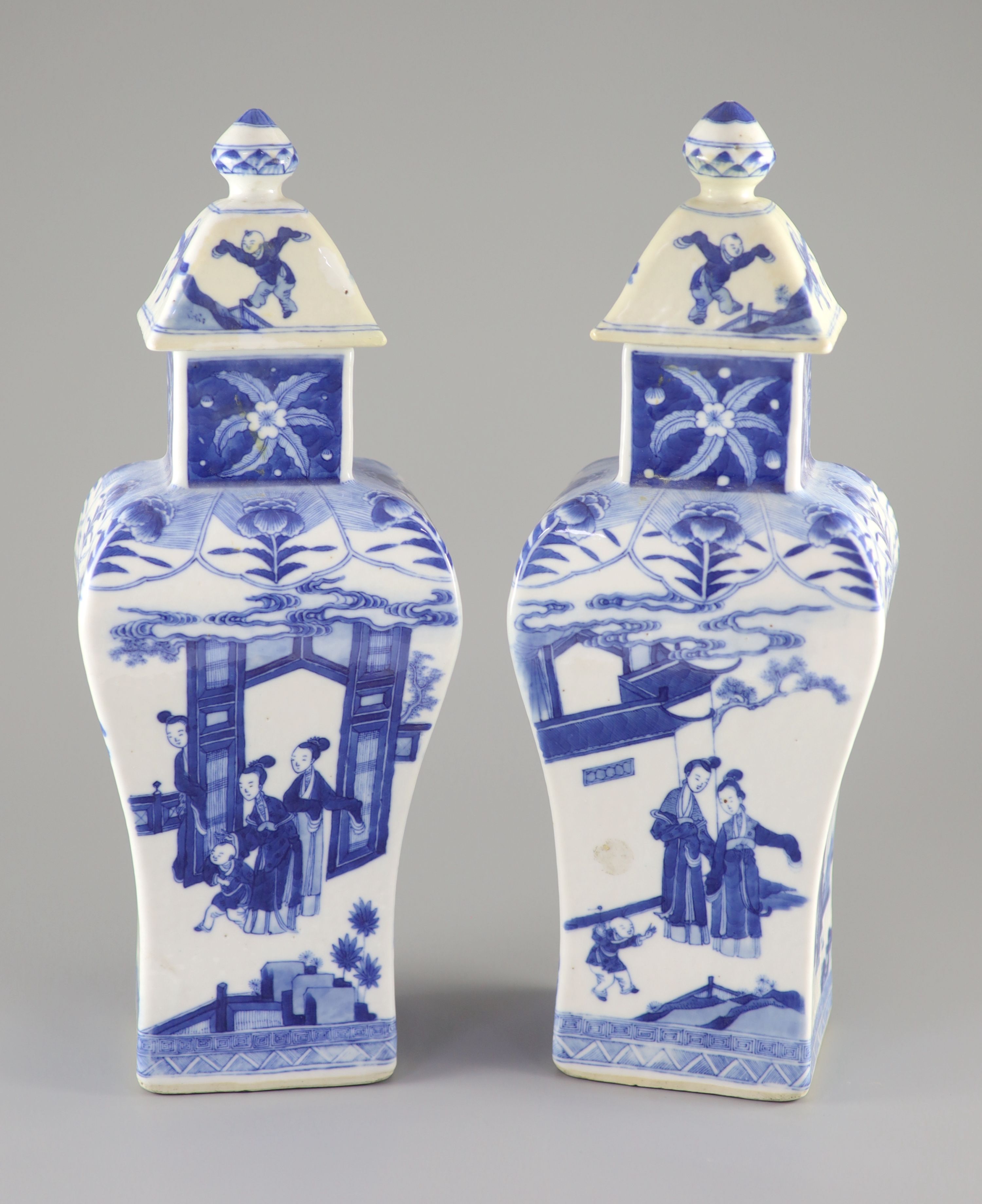 A pair of Chinese blue and white rectangular baluster vases and covers, Kangxi marks but 19th century, 36.5 cm